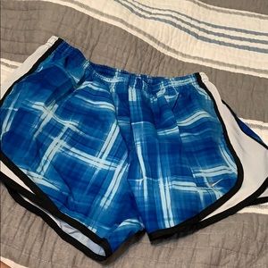 blue patterned nike athletic shorts